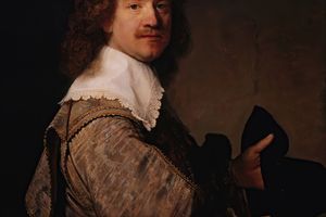 Portrait of a Man Holding a Black Hat 
