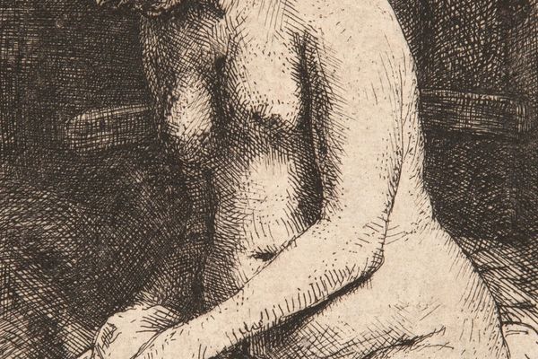 Woman bathing her feet at a brook 